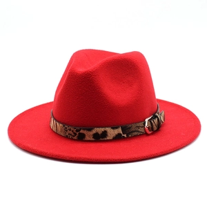 Detailed view of red wool fedora hat with leopard print band and silver metal buckle
