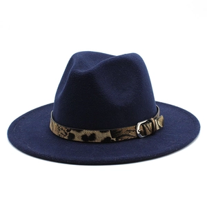 Navy blue wool fedora hat featuring leopard print band with silver buckle on white background