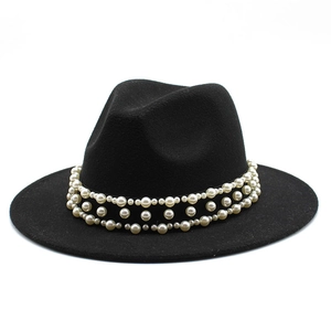 Close-up of black wool Fedora hat featuring triple layers of white pearl decorative bands