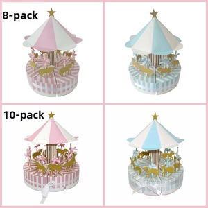 Detail of carousel gift boxes in pink and blue stripes with golden horse patterns
