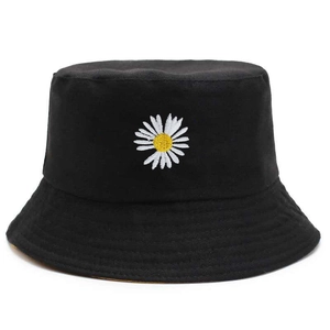 Kids black reversible bucket hat with white daisy embroidery on cotton fabric