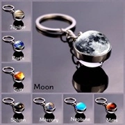 Solar system planet glass ball keychain collection featuring Moon and Jupiter designs