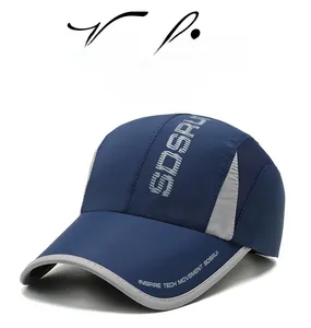 Detail of navy and grey quick-dry baseball cap featuring breathable side mesh and branding