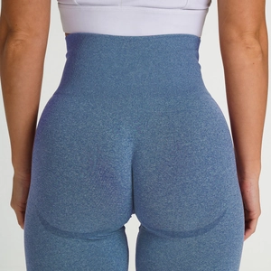 Detail of high waist seamless knit yoga pants with butt lift seam in heather blue