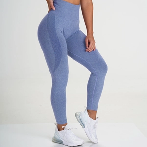 Detail showing the seamless marl blue fabric texture and high-waist band on fitness leggings