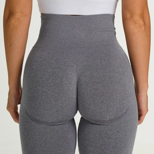 Detail of high waisted grey seamless yoga pants showing lifting U-shape hip seam and texture