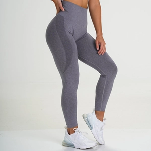 Detail view of seamless gray yoga leggings showing high waist and crescent knit texture