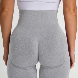 Detail of high waisted seamless yoga leggings with peach butt lifting design in light grey