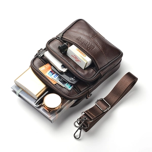 Men's dark brown leather waist bag with multi-zipper layers and adjustable shoulder strap