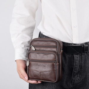 Brown litchi texture leather waist bag for men with triple zipper pockets on a model