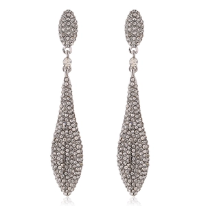 Macro shot of silver-tone teardrop earrings featuring luxurious full rhinestone pavé setting