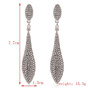 Macro shot showing dimensions 7.7cm height and 15.3g weight of luxury rhinestone drop earrings