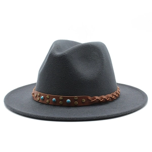 Close-up of dark grey wool fedora with brown woven belt, blue beads and copper rivets