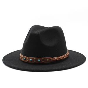 Detail of black wool fedora featuring a braided leather band with rivets and turquoise beads