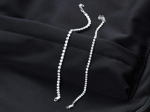 Detailed view of silver titanium steel hip-hop bracelet with sparkling crystal stones