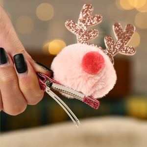 Pink plush ball and rose gold glitter reindeer antler hair clip for Christmas decor