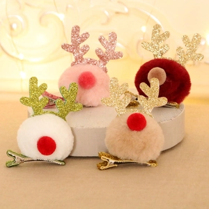 Set of 4 Christmas reindeer antler hair clips with plush pom poms and glitter detail