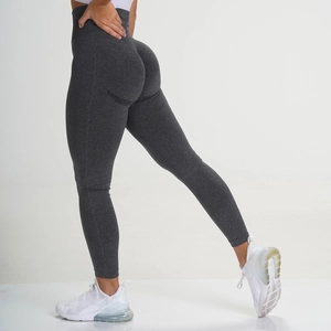 Detail of high-waisted seamless leggings showing peach lift texture and elastic fabric
