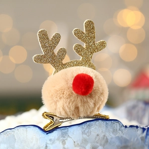 Christmas reindeer antler hair clip with golden glitter and brown plush pom-poms