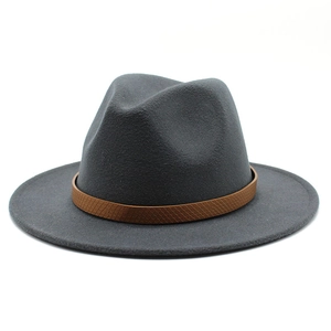 Close-up of a wide brim dark gray wool fedora hat featuring a brown snake skin embossed band