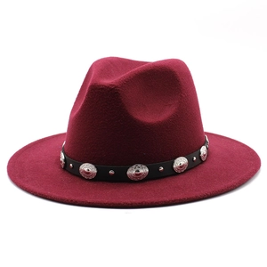 Close-up of burgundy wool felt fedora featuring a black belt with vintage silver studs