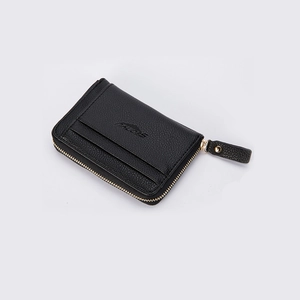 Detail view of the black textured leather wallet with gold zipper and functional card slots