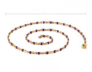 Detail view of adjustable gold stainless steel necklace with purple resin beads