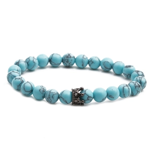 8mm blue turquoise bead bracelet set with a black crown charm on white background