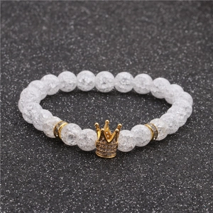 Elegant 8mm clear crackle stone bead bracelet featuring a gold crown with white zircons