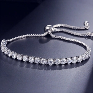 Close-up of adjustable silver tennis bracelet with sparkling round white crystals