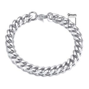 Detail view of 9mm wide silver stainless steel Cuban link bracelet on white background