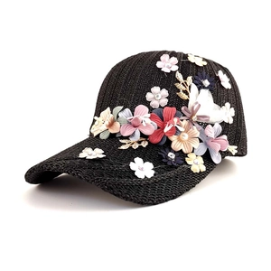 Women's woven baseball cap with 3D fabric flowers and golden metal leaf accents
