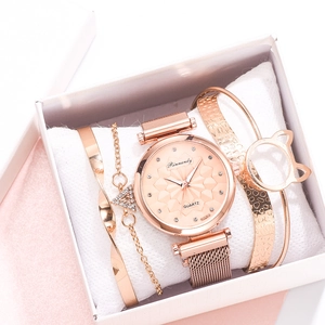 Detail of rose gold mesh watch with cat ear bracelets in a white gift box set