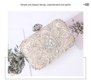 Macro shot of ivory clutch bag with intricate pearls, sequins and silver flower clasp