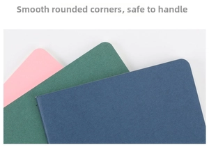 Detail of rounded corners on pink, dark green, and navy notebooks with smooth edges