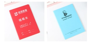 Detailed comparison of red error collection notebook and blue educational student stationery