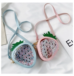 Detail of pink and blue sequined strawberry bags with transparent window and metal hooks