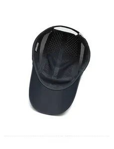Detailed interior view of a dark grey quick-dry sports cap showing mesh and laser holes