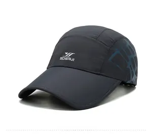 Detail of dark grey quick-dry baseball cap with laser-cut breathability and logo
