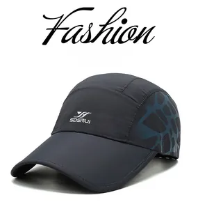 Detail of grey quick-dry baseball cap featuring blue geometric patterns and logo