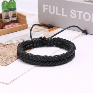 Handmade woven black wax cord bracelet with adjustable knot design for men and women