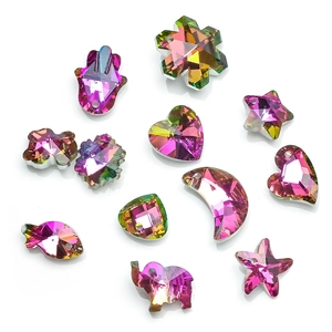 Close-up of colorful crystal charms in star, heart, and moon shapes with pre-drilled holes