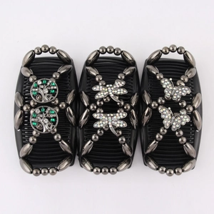 Detail of beaded magic hair combs with butterfly, dragonfly and tree patterns