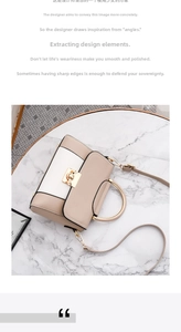 Dettaglio borsa a mano beige in pelle con manico ad anello dorato su piano in marmo
