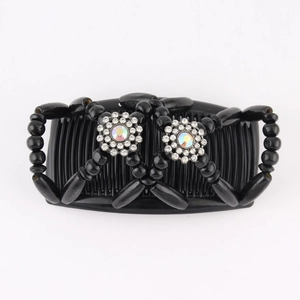 Detail of magic hair comb featuring black beads and iridescent rhinestone floral accents