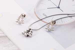 Detail shot of silver stainless steel tree jewelry set with necklace and earrings