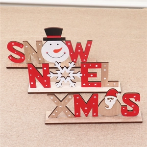 Detail of wooden SNOW, NOEL and XMAS letter ornaments with festive hand-painted patterns