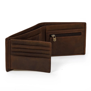 Detailed interior of vintage leather wallet showing card slots and zipper coin pocket