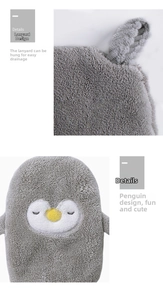 Detail of penguin hand towel featuring a sturdy hanging loop and soft coral velvet fabric