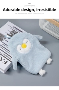 Detail view of cute blue penguin-shaped hand towel with soft coral fleece texture